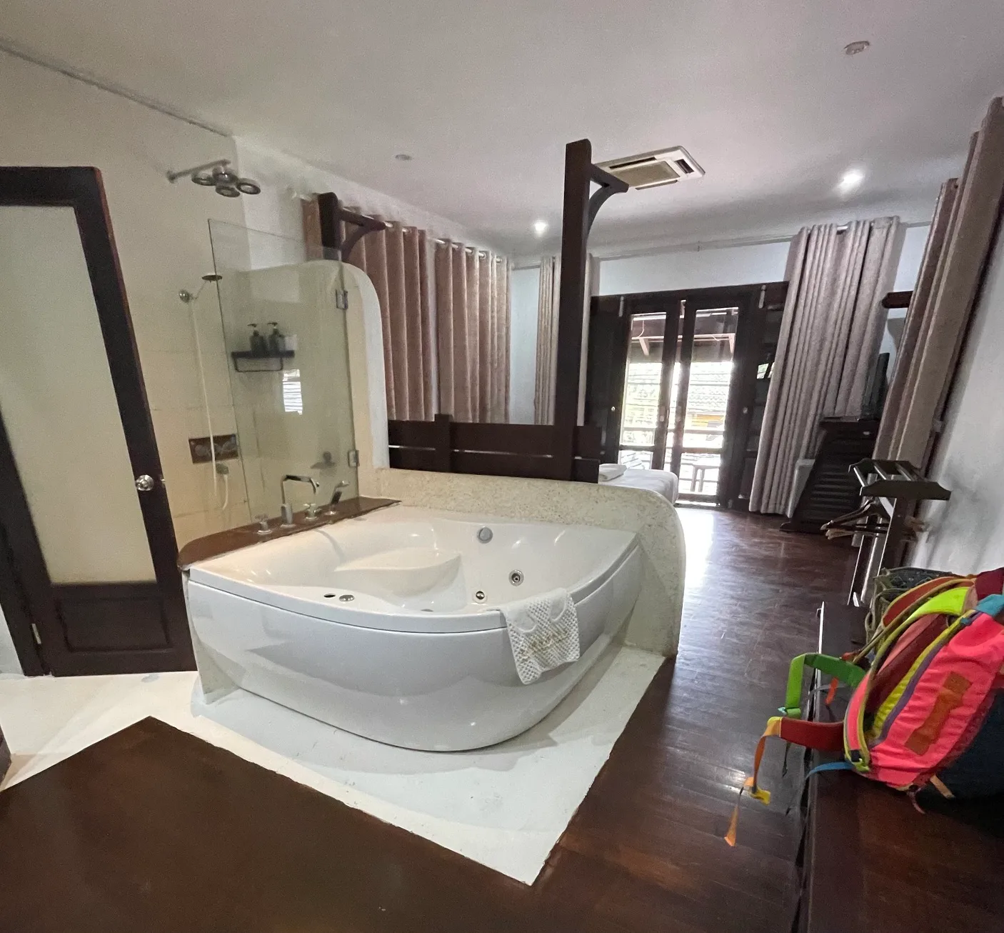 A hotel room in Laos with a jetted bathtub