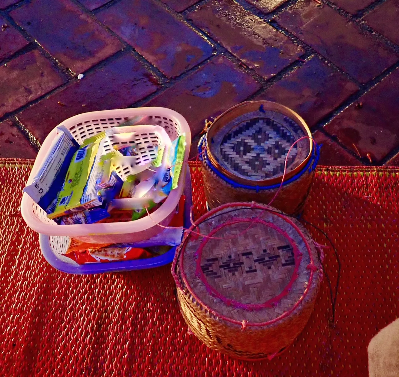 Offering of rice and snacks for monks in the Tak Bat Monk procession in Luang Prabang Laos