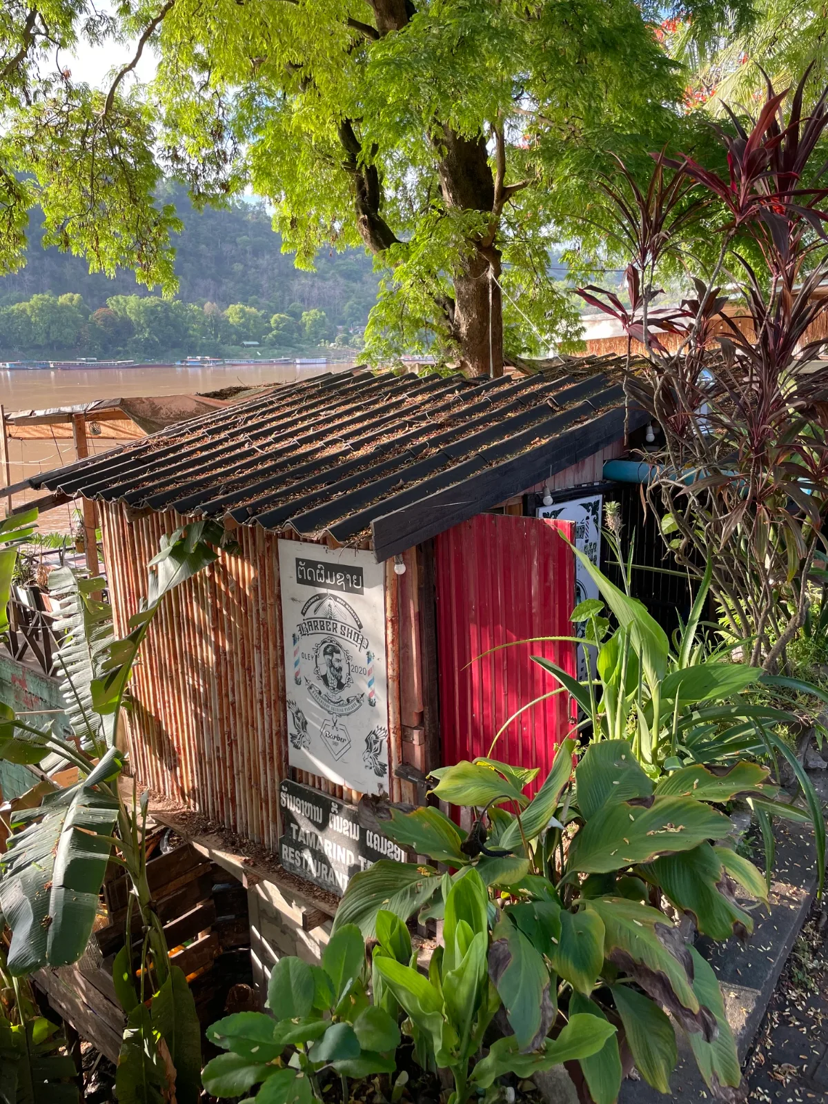 A barber shop along the banks of the Mekong River in Laos